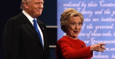 Democratic nominee Hillary Clinton (R) gestures next to Republican nominee Donald Trump during the first presidential debate at Hofstra University in Hempstead, New York on September 26, 2016. / AFP / Timothy A. CLARY        (Photo credit should read TIMOTHY A. CLARY/AFP/Getty Images)