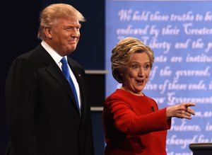 Democratic nominee Hillary Clinton (R) gestures next to Republican nominee Donald Trump during the first presidential debate at Hofstra University in Hempstead, New York on September 26, 2016. / AFP / Timothy A. CLARY        (Photo credit should read TIMOTHY A. CLARY/AFP/Getty Images)